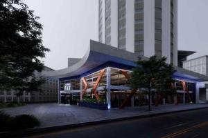 a large building with orangeazes on the front of it at AP Smart Glicério in Campinas