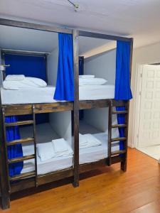 Ένα ή περισσότερα κρεβάτια σε δωμάτιο στο Carolina Hostel