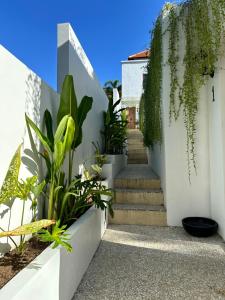 a stairway with plants on the side of a house at Santai Villas in Nusa Lembongan