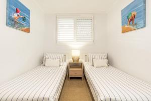 Ένα ή περισσότερα κρεβάτια σε δωμάτιο στο Craigmore 5 - Fantastic Ocean Views