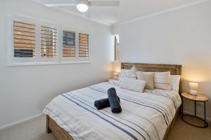 Una cama o camas en una habitación de Seagate Escape at Caloundra