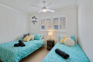 Una cama o camas en una habitación de Seagate Escape at Caloundra