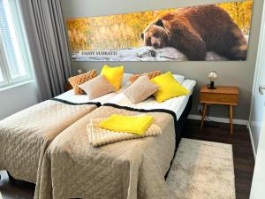 Katil atau katil-katil dalam bilik di Kivilinna Apartments Vuokatti - Liinavaatteet,pyyhkeet ja loppusiivous sisältyvät hintaan