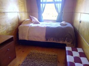 Postel nebo postele na pokoji v ubytování CABAÑAS RAYEN HUILLINCO