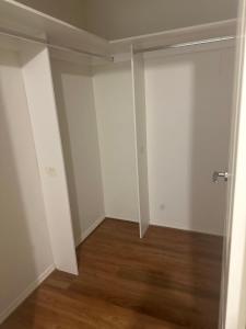 an empty room with white walls and wood floors at University lifestyle in Melbourne
