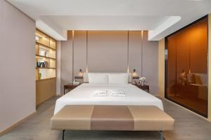 Voodi või voodid majutusasutuse Atour Hotel Changsha Binjiang Financial Center toas