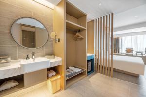 Voodi või voodid majutusasutuse Atour Hotel Changsha Binjiang Financial Center toas