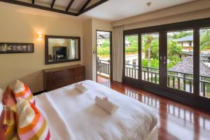 Кровать или кровати в номере Charming Chom Tawan Villa 3 bdr