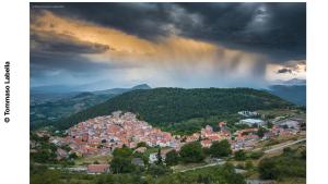 a city on a hill with a rainbow in the sky at CASA LaCosta in Pettoranello di Molise