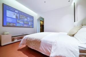 เตียงในห้องที่ Zhangjiajie Han Exotic Inn