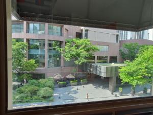 a view of a building from a window at Solo Stay Myeongdong in Seoul