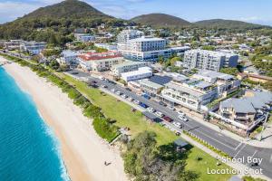 an aerial view of the beach and buildings at Del Rae 6 25 Shoal Bay Road in Shoal Bay