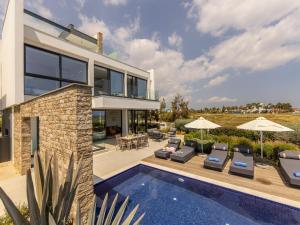 an image of a house with a swimming pool at Villa Pliades in Ayia Napa
