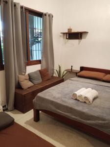 Postel nebo postele na pokoji v ubytování Pascoe's Units Siargao- Suites