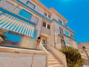 a house with blue and white at Casa Romano in Fiumicino +8 photos