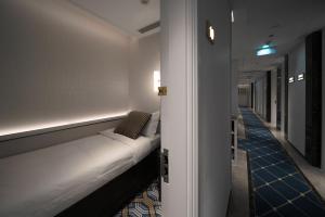 a room with a white couch in a hallway at East Pacific Passenger Lounge - Departure area, 3rd floor in Beijing +31 photos