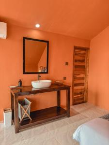 a bathroom with a sink and a mirror at Aloka Penida in Klungkung +60 photos