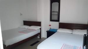 Katil atau katil-katil dalam bilik di Blue Ocean Hotel