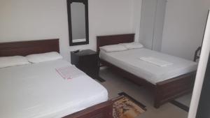 Katil atau katil-katil dalam bilik di Blue Ocean Hotel