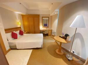 Predel za sedenje v nastanitvi Ramada Hong Kong Grand View