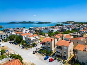 an aerial view of a town next to the water at Utopia Inn in Néa Péramos