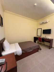 TV/trung tâm giải trí tại Rumman Hotel
