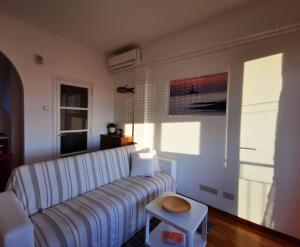 a living room with a couch and a table at Appartamento - Trieste in Trieste