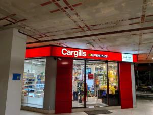 a store with a red sign on the front of it at Urban View by CityScape in Colombo