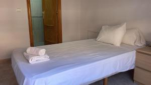 Postel nebo postele na pokoji v ubytování Hotel Algorfa