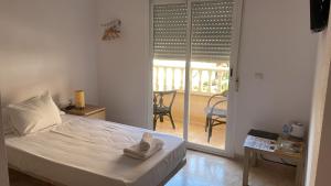 Postel nebo postele na pokoji v ubytování Hotel Algorfa