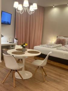 Postel nebo postele na pokoji v ubytování Die "Boho Suite" im Herzen von Hartberg I Parking