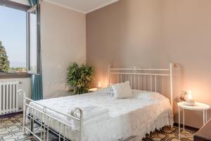 Postel nebo postele na pokoji v ubytování Casa Olimpia