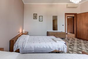 Postel nebo postele na pokoji v ubytování Casa Olimpia