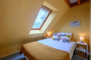 Postel nebo postele na pokoji v ubytování L'Appel du Large - Duplex vue mer Penvins Sarzeau + 6 fotografií