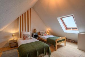 Postel nebo postele na pokoji v ubytování L'Appel du Large - Duplex vue mer Penvins Sarzeau