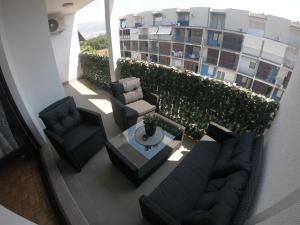 Uma área de estar em Apartment Ena