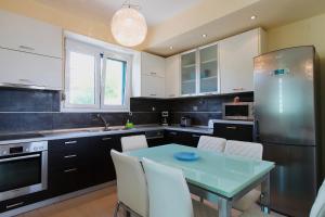 Kuchyň nebo kuchyňský kout v ubytování Hemera House Posidi K3