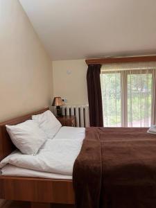Ένα ή περισσότερα κρεβάτια σε δωμάτιο στο Nectar hotel