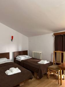Postel nebo postele na pokoji v ubytování Nectar hotel