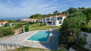 an aerial view of a house with a swimming pool at Hemera House Posidi K3 in Possidi