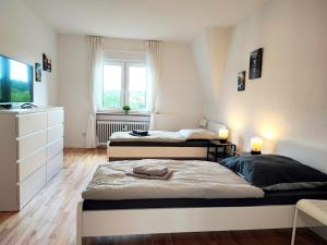 Postel nebo postele na pokoji v ubytování Modern & Chic Apartment with Balcony in Offenbach