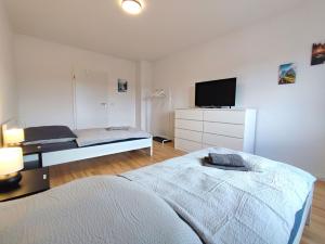 Postel nebo postele na pokoji v ubytování Modern & Chic Apartment with Balcony in Offenbach