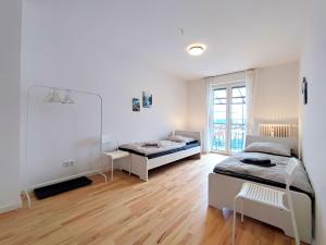Postel nebo postele na pokoji v ubytování Modern & Chic Apartment with Balcony in Offenbach