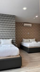 Ada Hotel & Apartment客房内的一张或多张床位