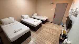 Ada Hotel & Apartment客房内的一张或多张床位