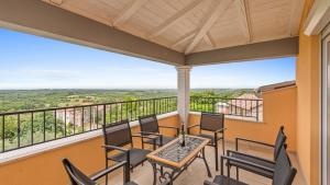 a balcony with chairs and a table with a view at Villa Damian in Umag