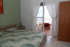 A bed or beds in a room at George & Katerina Houses