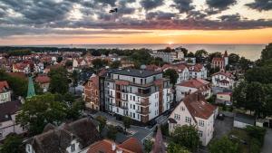 an aerial view of a city at sunset at Ustka Aquarius, Sun & Snow in Ustka