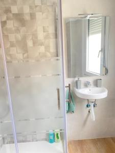 a bathroom with a shower and a sink at Mundaka plaza in Mundaka +8 photos