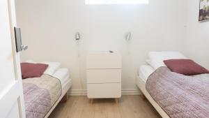 Postel nebo postele na pokoji v ubytování Hilmors Overnatning + 13 fotografií